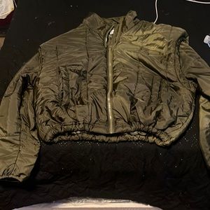 Olive green puffer jacket with adjustable strings to have it cropped or normal